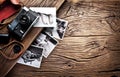 Old rangefinder camera and black-and-white photos. Royalty Free Stock Photo