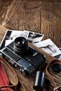 Old rangefinder camera and black-and-white photos. Royalty Free Stock Photo