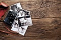 Old rangefinder camera and black-and-white photos. Royalty Free Stock Photo