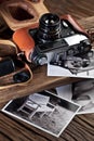 Old rangefinder camera and black-and-white photos. Royalty Free Stock Photo