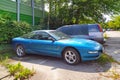 Old rare blue Ford Probe parked in summer July light