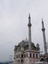 An old rarity Muslim eastern Turkish mosque with a minaret and a shiny yellow crescent
