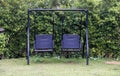 Old rattan swing for relaxtion in the garden