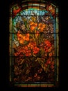 Old Realistic Stained Glass Window with the image of a orange flowers