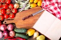 Old recipe book with vegetables for cooking Royalty Free Stock Photo