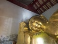 Old Reclining Buddha in the old chapel with gold color