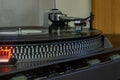 An old record player that still works and can read music from vinyl records.