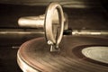 Old record player stylus on a rotating disc Royalty Free Stock Photo