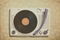 Old record player on top of flower wallpaper Royalty Free Stock Photo