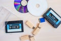 Old recorder cartridge, USB stick, and compact disks together Royalty Free Stock Photo