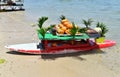 Old recycled surfboard has now become an original floating exotic bar.