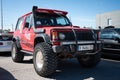 Old red all-terrain Mitsubishi Montero parked on the street