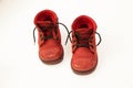 Old red baby shoes on white background Royalty Free Stock Photo