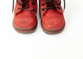 Old red baby shoes on white background Royalty Free Stock Photo