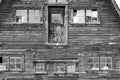 Old red barn with red broken window. Royalty Free Stock Photo