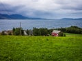 An old red barn on the coast of the Norwegian fjord