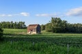 Old red barn on green farmers field Royalty Free Stock Photo