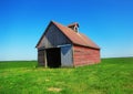 Old Red Barn in Green Field Royalty Free Stock Photo