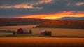 Old Red Barn on Hay Field at Sunrise with Bales of Hay. Royalty Free Stock Photo