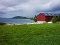 Old red barn on the Norwegian fjord Royalty Free Stock Photo