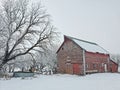 Old red barn standing after an winter ice storm Royalty Free Stock Photo