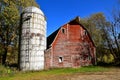 Old red barn and stave silo Royalty Free Stock Photo