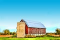 Old red barn with stone silo Royalty Free Stock Photo