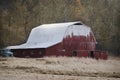 Old red barn with white roof in rural Indiana.