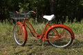 Re-conditioned old red bicycle