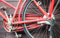 Old red bike on the background of a brown wooden wall Royalty Free Stock Photo