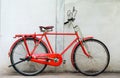 Old red bike and cement wall Royalty Free Stock Photo