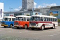 The old red and blue Skoda bus rides through the streets of the Polish capital. Tourist bus vintage model. The street of