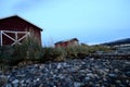 Old red boat house next to sea shore Royalty Free Stock Photo