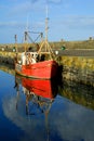 Old red boat in Howth Harbor, Dublin, Ireland Royalty Free Stock Photo