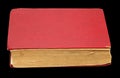 Old red book on a black background Royalty Free Stock Photo