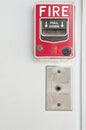 Old red box of fire alarm on white wall background Royalty Free Stock Photo