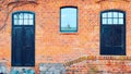 old red brick barn with wooden doors Royalty Free Stock Photo