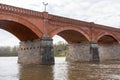 The old red brick bridge across the Venta river. Kuldiga, Latvia Royalty Free Stock Photo