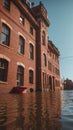 Old red brick building flooded with sun and traffic light. Royalty Free Stock Photo