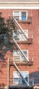 Old red brick building with iron fire escape, New York City, USA Royalty Free Stock Photo