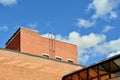 Old red brick building with metal ladder to roof Royalty Free Stock Photo