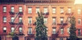 Old red brick buildings with iron fire escapes, color toning applied, New York City, US Royalty Free Stock Photo