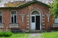 an old red brick house with embossed white brick masonry beautifully decorated doorways and windows