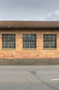 Red brick industrial building with large windows Royalty Free Stock Photo