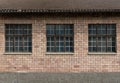 Red brick industrial building with large windows Royalty Free Stock Photo