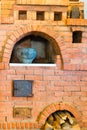 Old red brick oven and a pot Royalty Free Stock Photo