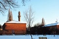 Old red brick pipe with stairs and observation platform, residential district with houses, winter snowy streets with trees Royalty Free Stock Photo