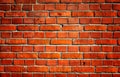 Old Red brick wall. Background with spotlight light in the middle Royalty Free Stock Photo