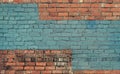 Old red brick wall with blue paint