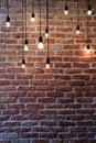 Old red brick wall with bulb lights lamp Royalty Free Stock Photo